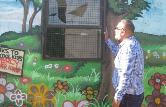 Abdullah inspects the vandalism at the StreetWatch base, Balsall Heath